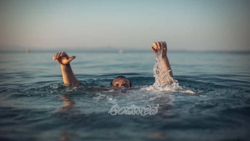 man sinking in water